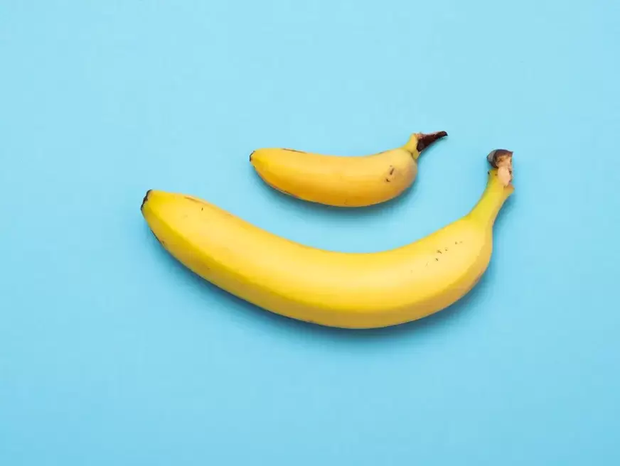Small and pompously enlarged penis in the example of bananas